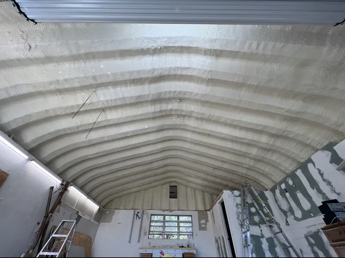 Spray polyurethane foam applied to the underside of a metal roof deck in Thompson's Station